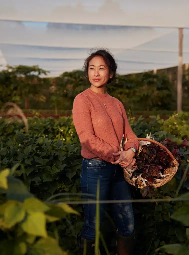 Palisa Anderson picking some organic vegetables for her home cooked meal